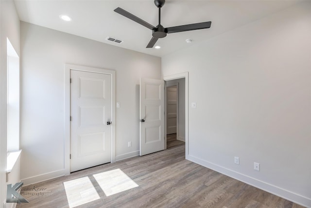 unfurnished bedroom with light wood finished floors, recessed lighting, visible vents, ceiling fan, and baseboards