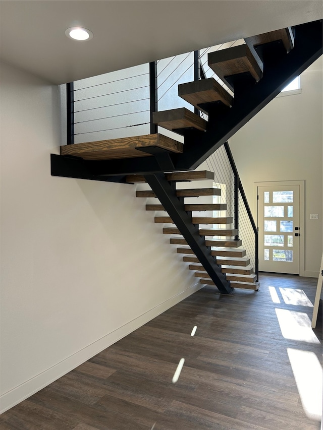 stairway featuring hardwood / wood-style floors