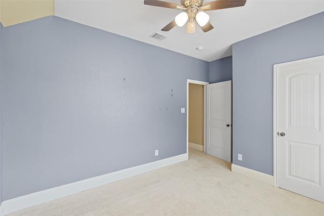 unfurnished bedroom with ceiling fan and light carpet