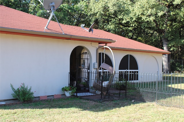 rear view of house with a yard