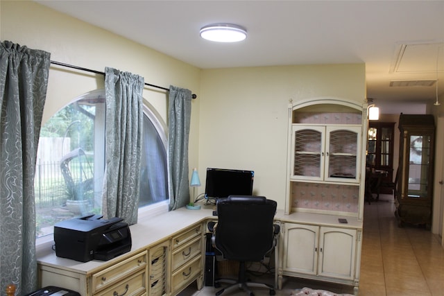 office area with a healthy amount of sunlight and light tile patterned floors