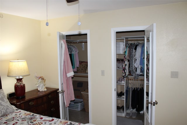 bedroom with two closets