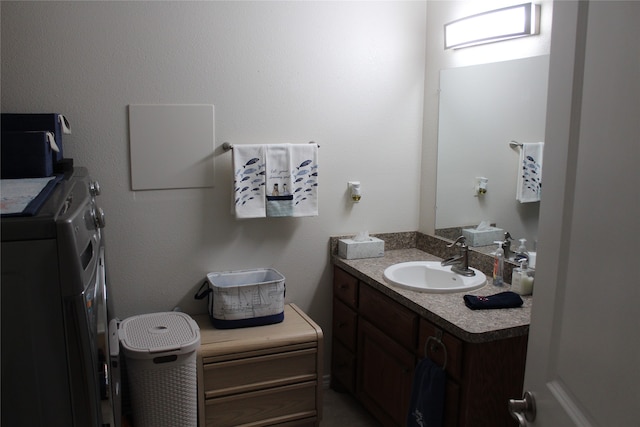 bathroom with vanity and independent washer and dryer