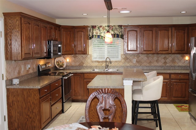 kitchen with a kitchen island, stainless steel appliances, backsplash, sink, and light tile patterned floors