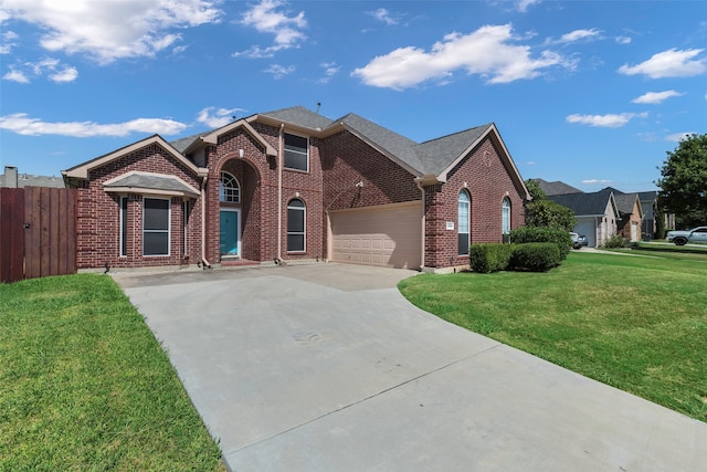 view of front of house featuring a front lawn and a garage