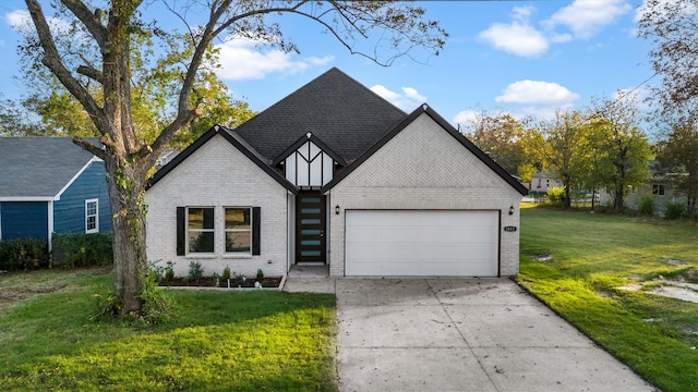 view of front of property with a front lawn and a garage