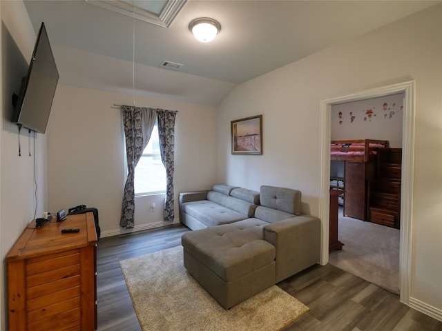 living room with dark hardwood / wood-style flooring and lofted ceiling