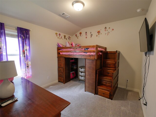 carpeted bedroom with lofted ceiling