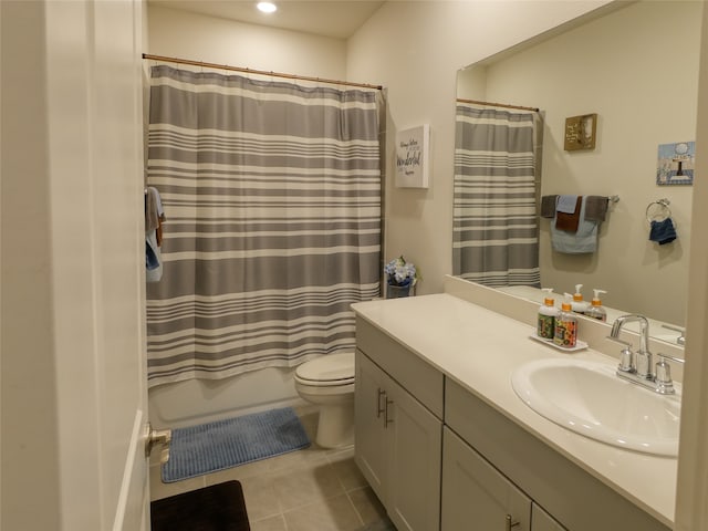 full bathroom with toilet, vanity, tile patterned floors, and shower / bathtub combination with curtain