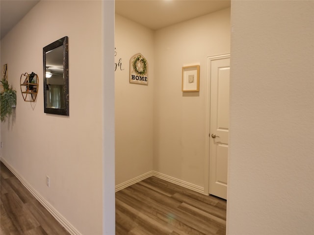 corridor featuring dark hardwood / wood-style floors