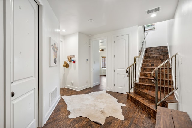 foyer with dark hardwood / wood-style floors