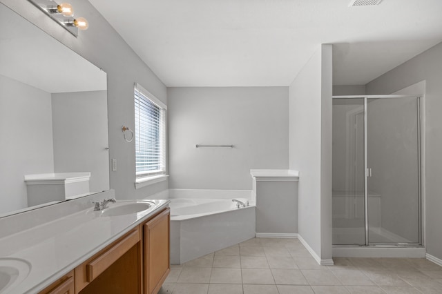 bathroom with shower with separate bathtub, tile patterned flooring, and vanity