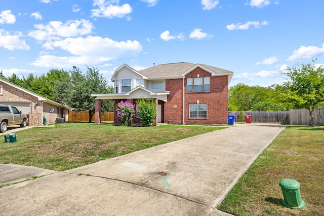 view of property featuring a front lawn