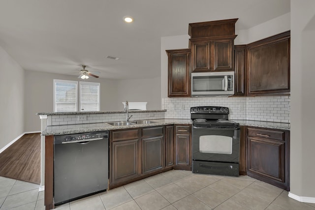 kitchen featuring black appliances, kitchen peninsula, sink, and ceiling fan