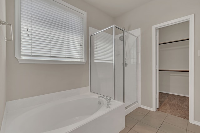 bathroom featuring independent shower and bath and tile patterned floors