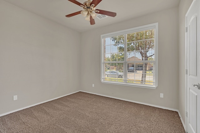 carpeted empty room with ceiling fan