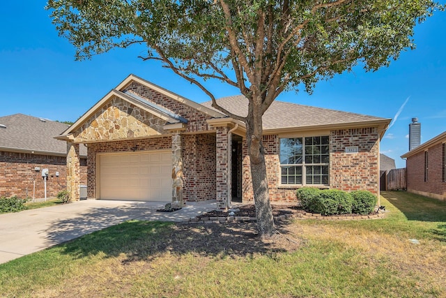 view of front of home featuring a front yard and a garage