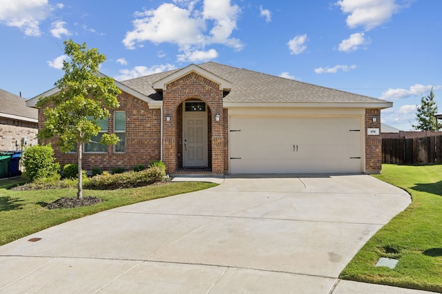 single story home featuring a front lawn and a garage