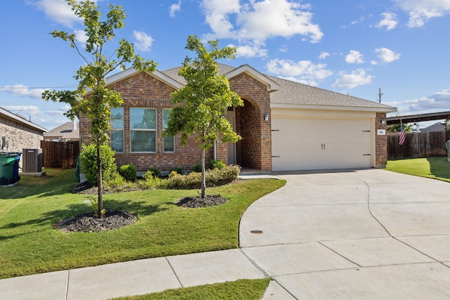 view of front of house with a front yard, central AC, and a garage