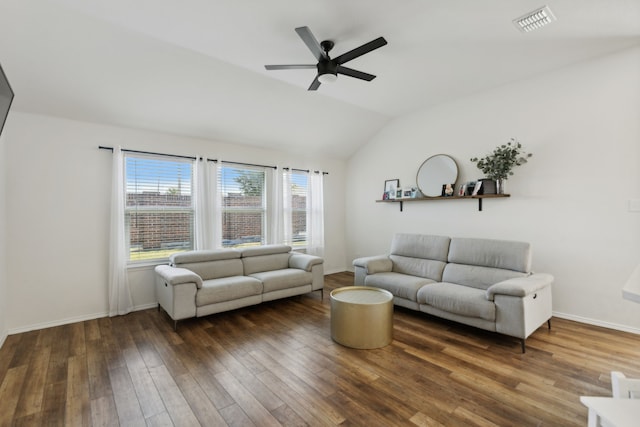 living room with dark wood-type flooring, ceiling fan, and vaulted ceiling