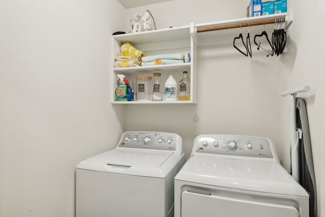 clothes washing area with washing machine and clothes dryer