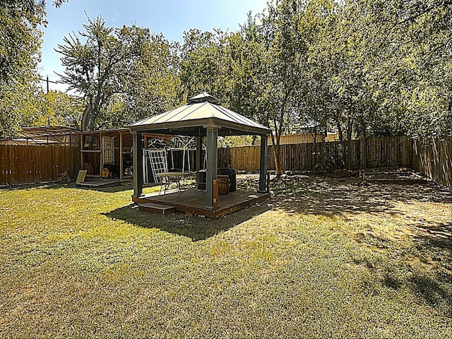 view of yard featuring a wooden deck and a gazebo