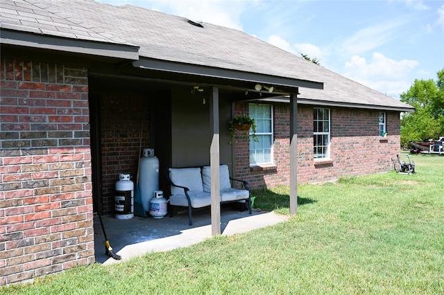 exterior space featuring ceiling fan, a yard, and a patio