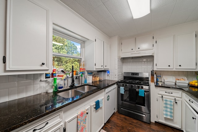 kitchen with white cabinets, dark hardwood / wood-style flooring, stainless steel range with gas stovetop, ornamental molding, and sink