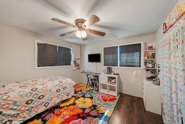 bedroom featuring ceiling fan and dark wood-type flooring