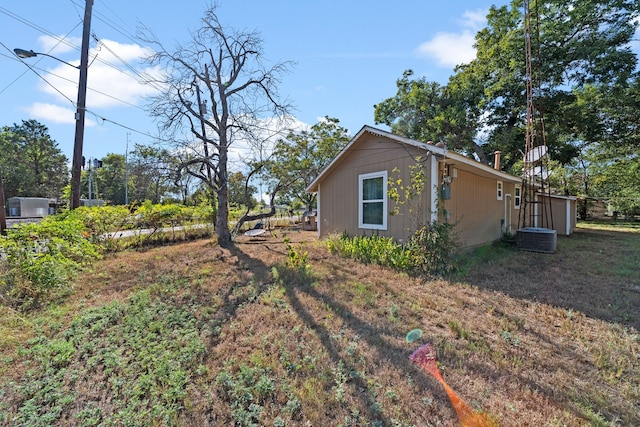 view of side of property with cooling unit