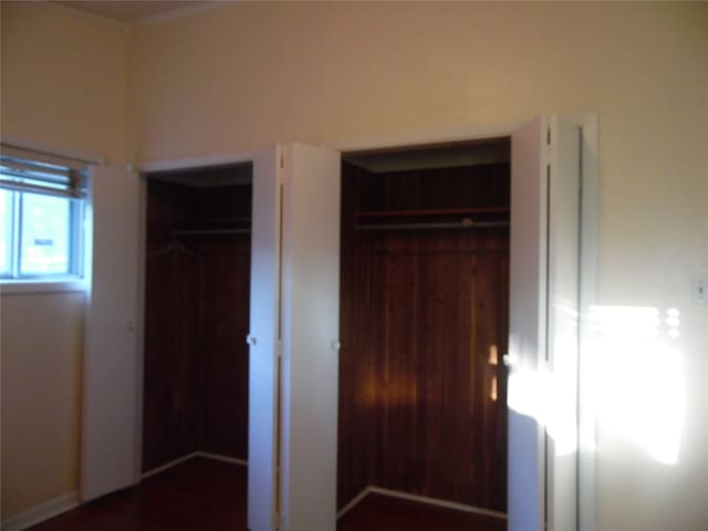 unfurnished room with hardwood / wood-style flooring