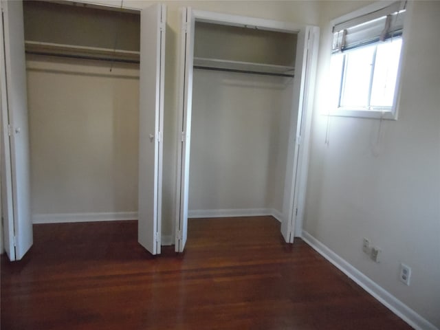 spare room with ceiling fan and dark hardwood / wood-style floors