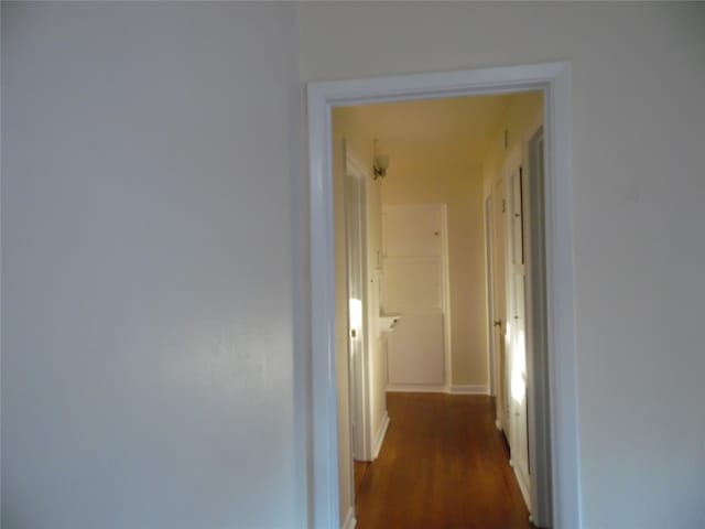 spare room featuring crown molding and dark hardwood / wood-style flooring