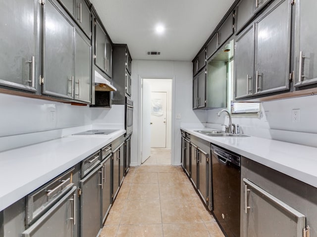 kitchen featuring dishwasher, light tile patterned flooring, sink, stovetop, and stainless steel oven