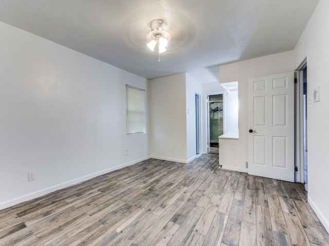 unfurnished bedroom with light hardwood / wood-style flooring and ceiling fan