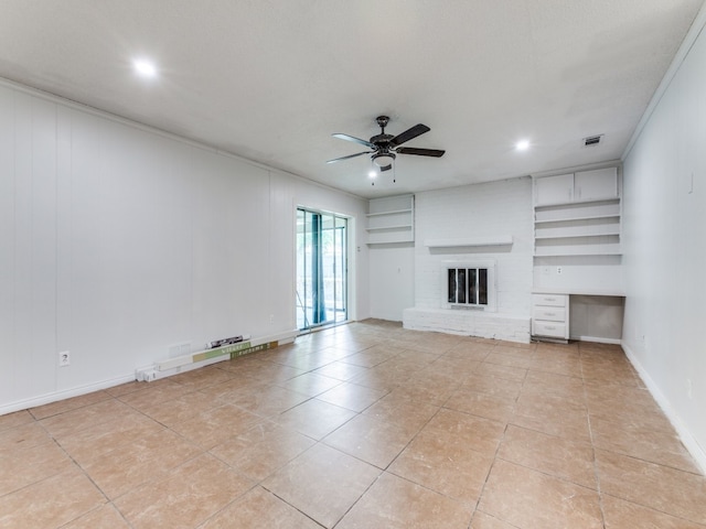 unfurnished living room with light tile patterned flooring, a fireplace, a textured ceiling, ceiling fan, and built in shelves