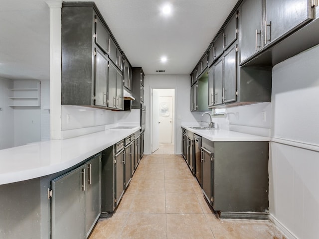 kitchen featuring sink, light tile patterned floors, and stainless steel appliances