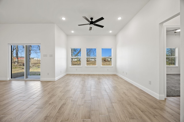 unfurnished living room featuring recessed lighting, light wood-type flooring, baseboards, and a ceiling fan