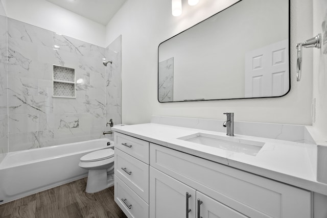 full bath featuring tub / shower combination, toilet, vanity, and wood finished floors