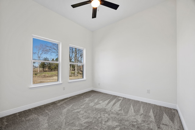 carpeted empty room with baseboards and ceiling fan