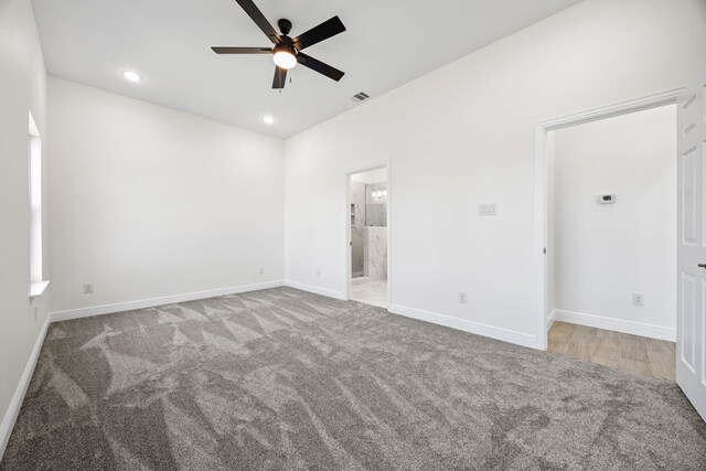 unfurnished bedroom with carpet, recessed lighting, visible vents, and baseboards