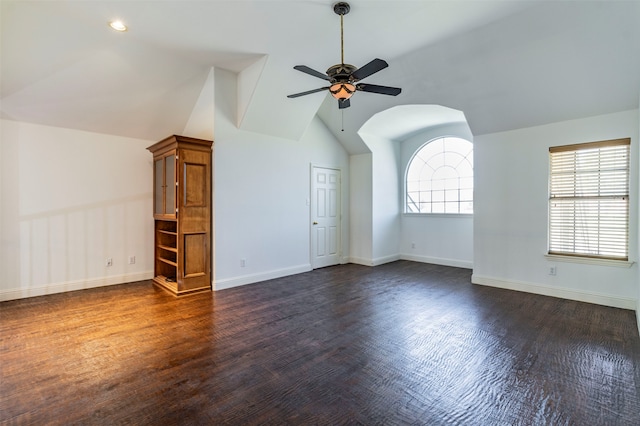 bonus room featuring ceiling fan, vaulted ceiling, and dark hardwood / wood-style flooring