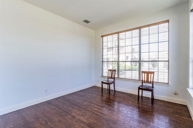 unfurnished room featuring dark hardwood / wood-style floors