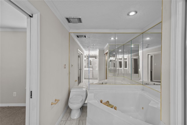 bathroom with a textured ceiling, crown molding, toilet, and a bath