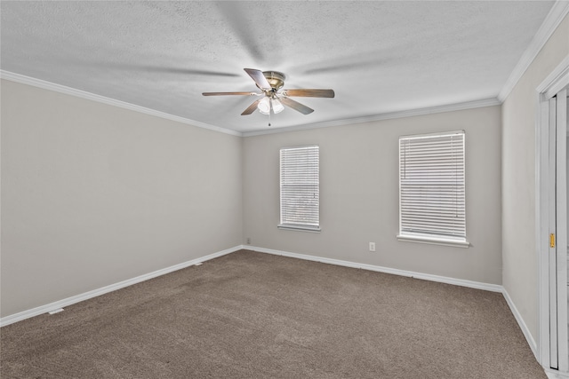 carpeted spare room featuring ornamental molding, ceiling fan, and a textured ceiling