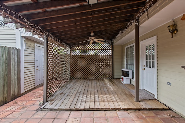 wooden deck featuring ceiling fan and a patio area