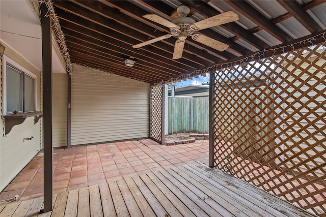 wooden deck featuring ceiling fan and a patio area