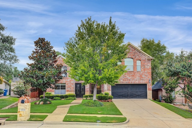 obstructed view of property featuring a front lawn and a garage