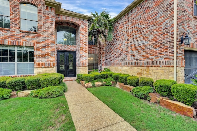 property entrance with a yard