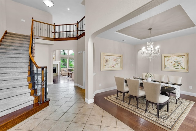 dining space featuring light hardwood / wood-style flooring and a notable chandelier